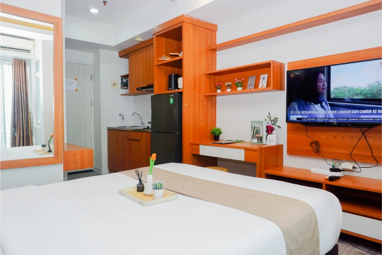 Bedroom 2, Good and Comfy Studio Apartment at Grand Kamala Lagoon By Travelio, Bekasi
