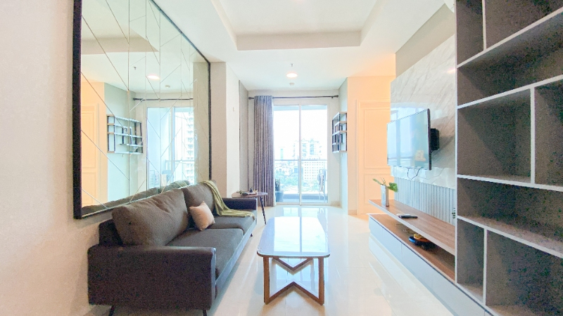 Living Room 5, Fancy and Good Design 2BR at Grand Madison Apartment By Travelio, Jakarta Barat