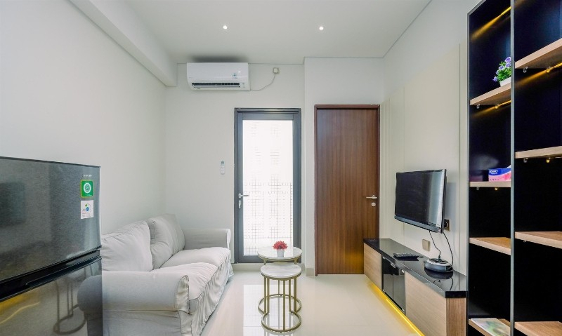 Living Room 4, Comfortable 1BR with Extra Room at Transpark Cibubur Apartment By Travelio, Depok