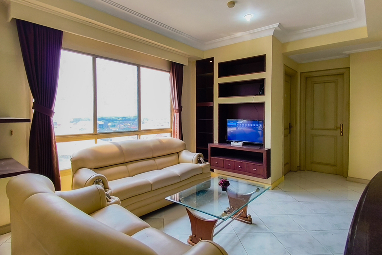 Living Room 3, Classic and Warm 2BR at Apartment Taman Beverly By Travelio, Surabaya