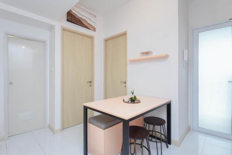 Living Room 4, Nice and Restful 2BR at Apartment Tokyo Riverside PIK 2 By Travelio, Tangerang