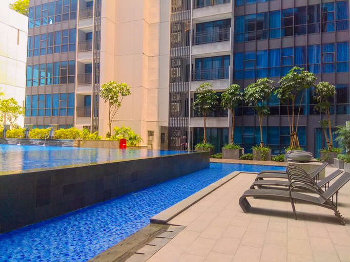 Swimming Pool 3, Chic and Roomy 2BR Space at Apartment Casa Grande Residence By Travelio, Jakarta Selatan