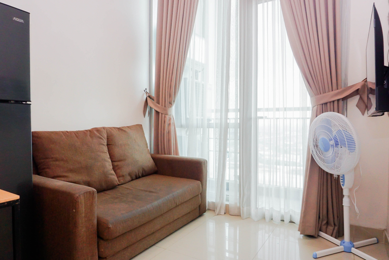 Living Room 3, Minimalist 1BR Apartment at Tamansari Iswara By Travelio, Bekasi