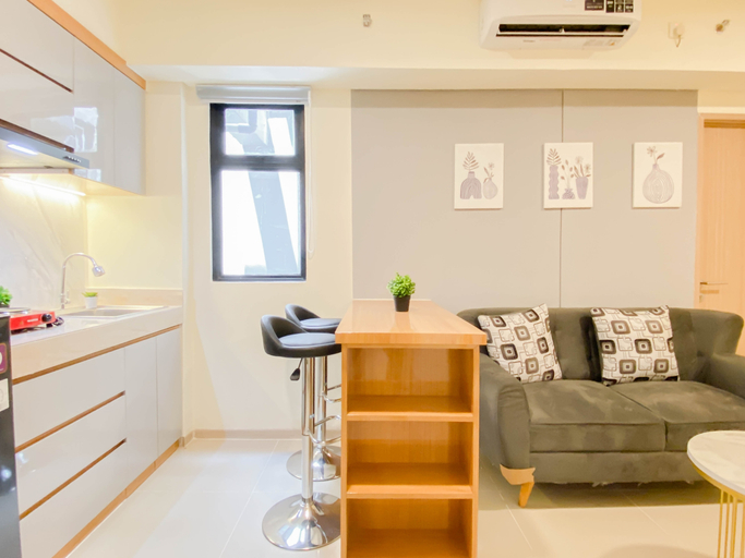 Living Room 4, Classic and Warm 2BR at Apartment Meikarta District 2 By Travelio, Cikarang
