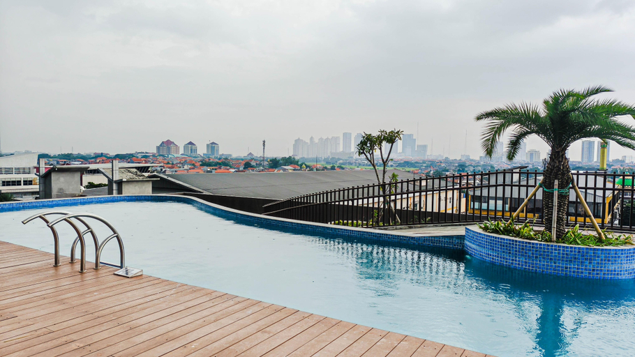 Swimming Pool 4, Pleasureable Studio Apartment at Westown View Surabaya By Travelio, Surabaya