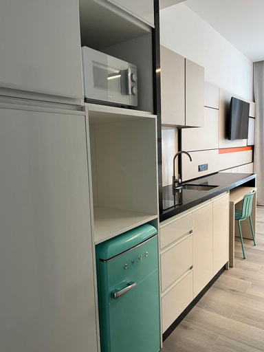 Private kitchen, Leganés Urban Apartments by gaiarooms, Madrid