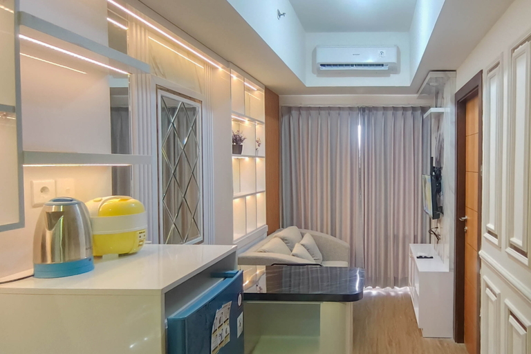 Living Room 2, Functional and Cozy 2BR Apartment at Vida View Makassar By Travelio, Makassar