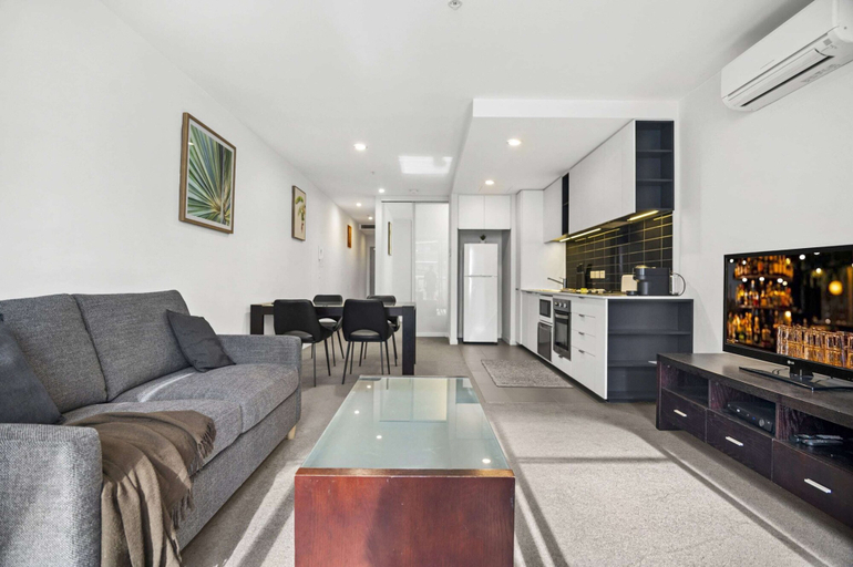 Living area 3, 1BR Docklands Walk to Marvel Stadium + Balcony, Melbourne