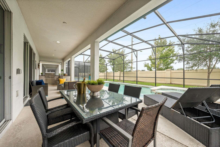 Outdoor dining, Spacious 9br, 9BA Resort Home w/ Private Pool, Osceola