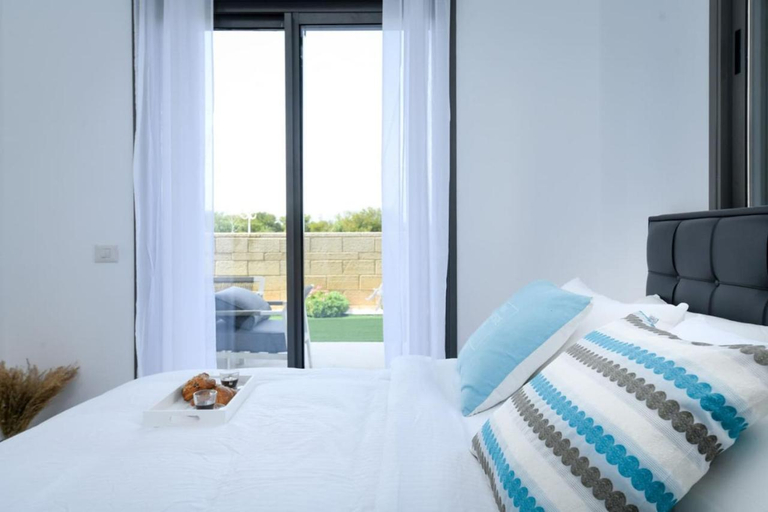 Bedroom 2, Modern 4BR Garden Apartment with Private Balcony