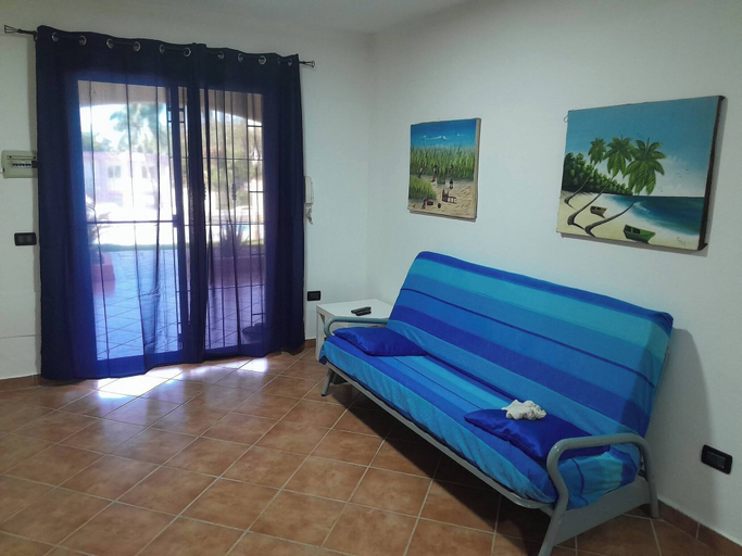 Living room, Serene 1-bedroom Apartment With Shared Pool in Boca Chica, Boca Chica