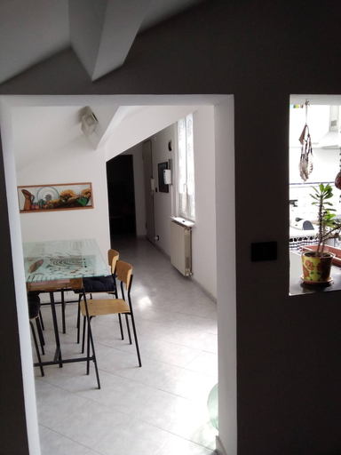 Dining room, Spacious and Naturally Bright Bomboniera Rooftop Favors Apartment, Genova