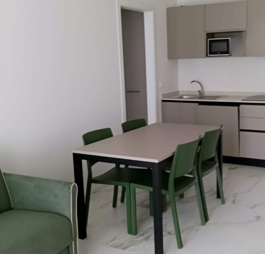 Dining room, Renovated Flat With Private Fenced Garden in Bibione, Venezia