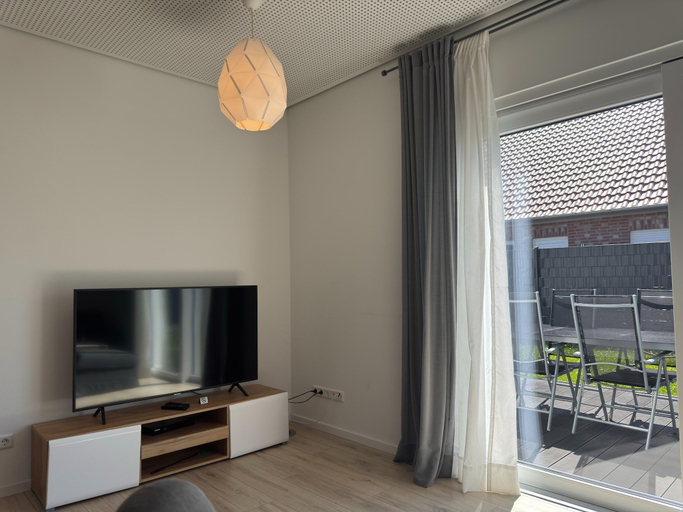 Living room 2, Moderne Ferienwohnung mit Sauna & Terrasse, Wesermarsch