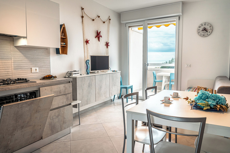Dining room, Seaside Retreat With Terrace in Bibione, Venezia