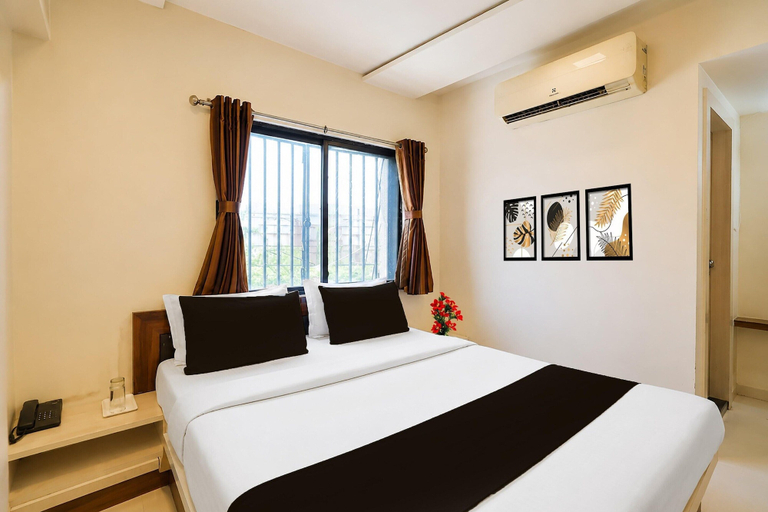 Room 5, Classic Red Apple, Ahmadabad