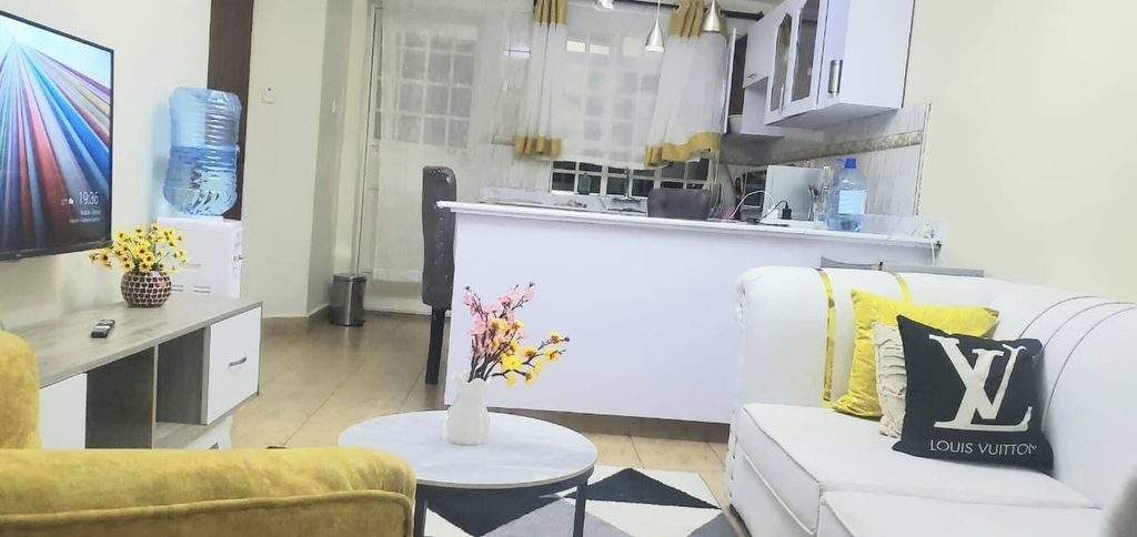 Living room 5, Jolly 1br With AC, Backup Gen, Netflix, Balcony, Kisumu Central