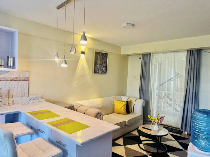 Living room 3, Jolly 1br With AC, Backup Gen, Netflix, Balcony, Kisumu Central