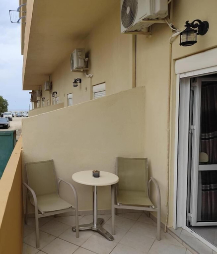 Outdoor dining, Beachfront Kala's Suites Apartments, Crete