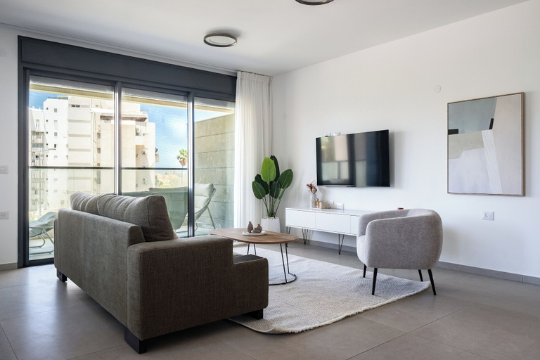 Living area 5, Stylish 4BR Apt l Balcony & Mamad