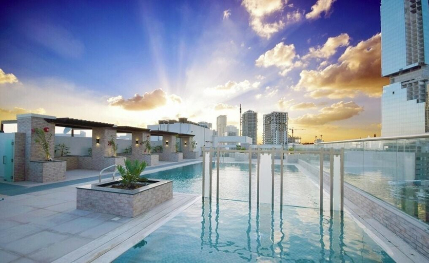 Outdoor pool, Yogi 1BR Pool Gym & Balcony JVC, Dubai