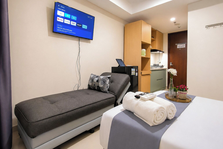 Television, Airy Contemporary Studio At Grand Sungkono Lagoon Apartment, Surabaya