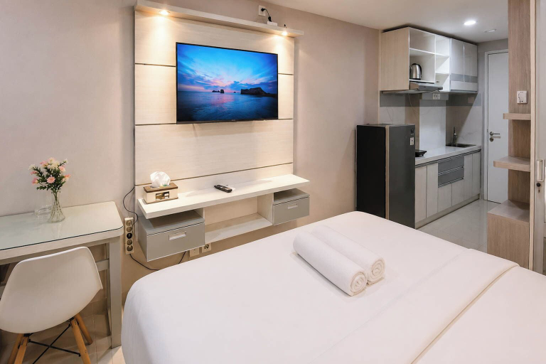 Television, Elegant And Airy Studio At Apartment Tamansari Skylounge Makassar, Makassar