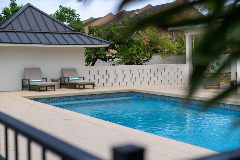 Room 1, 5BR Luxe Retreat in Runaway Bay Private Pool Beach Access