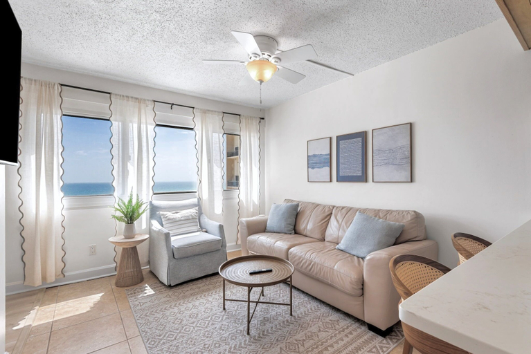 Living area 4, 2BR Beachfront Condo w Private Beach, Pools, Tennis + Free Attraction Tix!, Bay