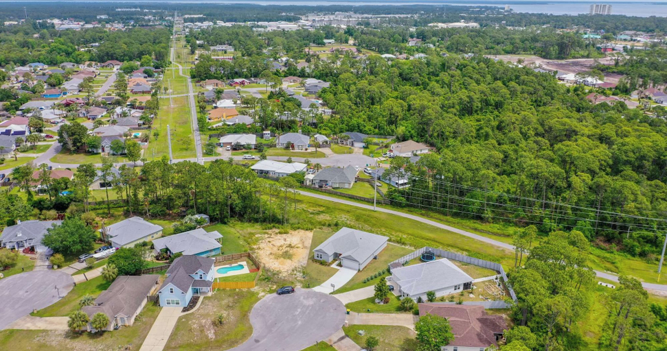 Aerial view 2, 4BR Home With Fenced Yard & Grill, Bay