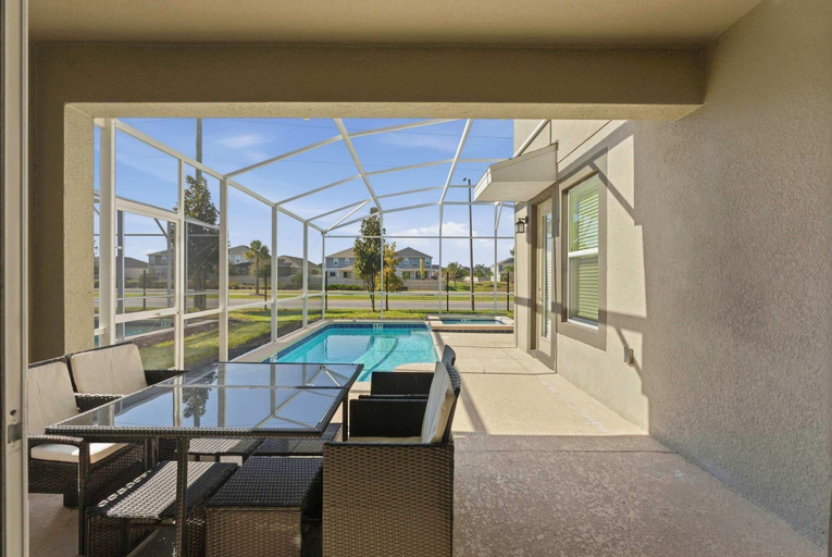 Outdoor dining 4, 5BR Resort Home w/ Private Pool Near Disney, Osceola