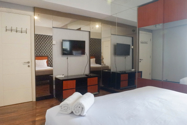 Bedroom 1, Vibrant and Luxurious 2BR Apartment at Trillium Residence Surabaya By Travelio, Surabaya